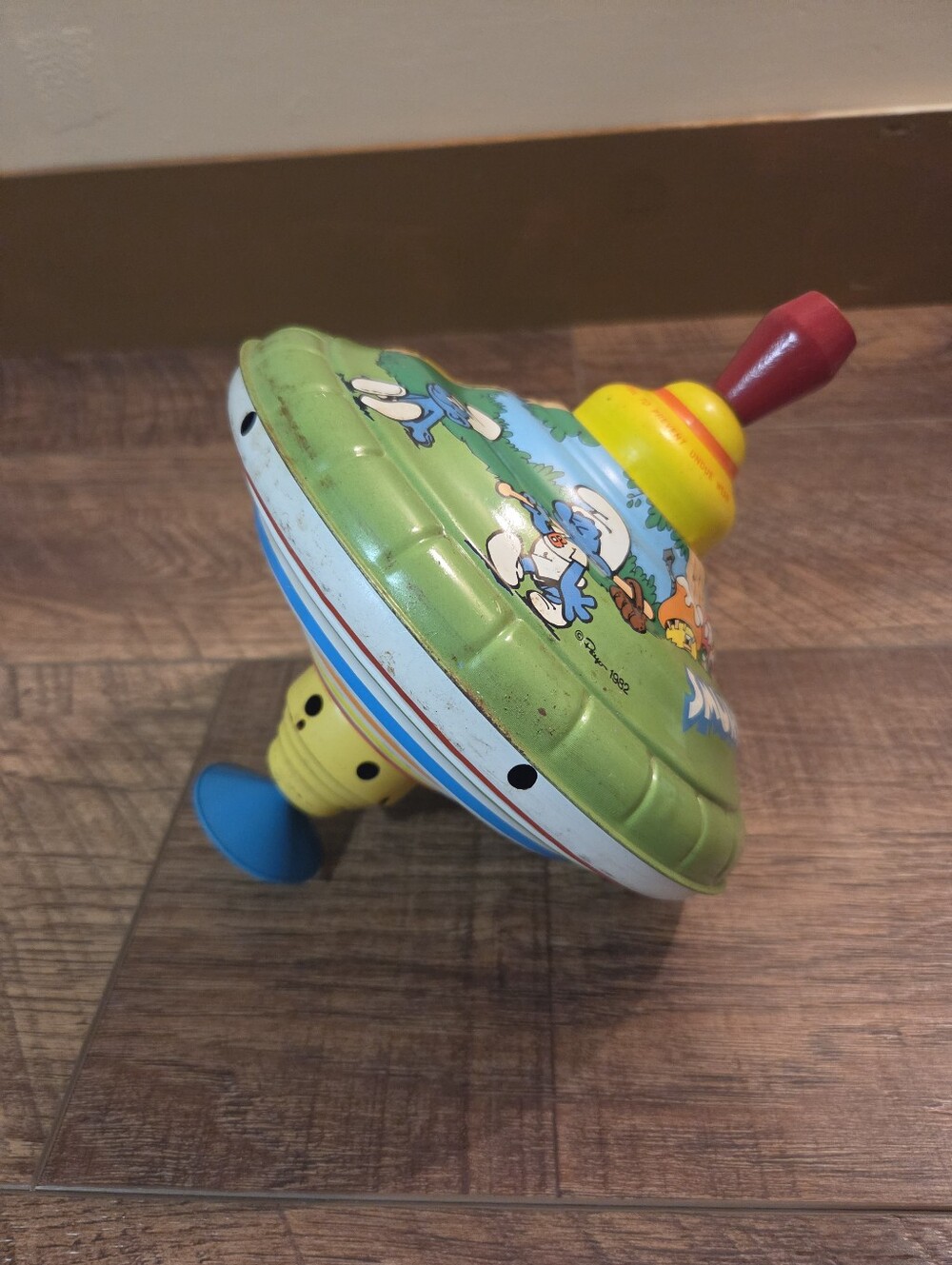 Vintage 1982 Smurfs tin litho spinning top manufactured by the Ohio Art Company